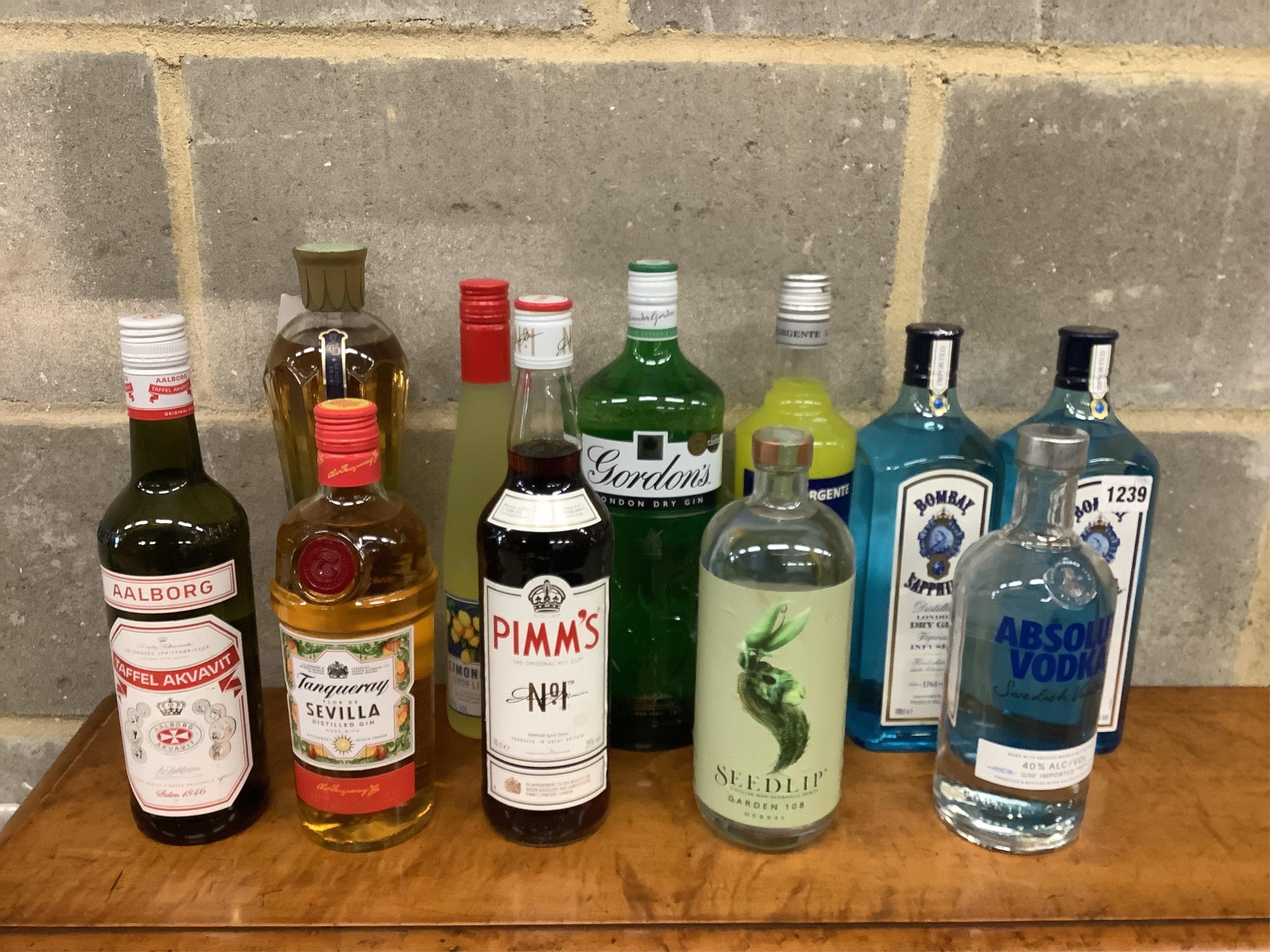 Ten bottles of assorted Gin and Liqueur to include Tanqueray Sevilla, Bombay Sapphire, St. Germain and Pimms. (Surplus stock from a local wedding event company).